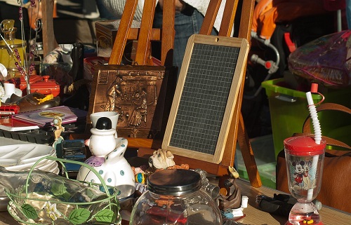 Various items displayed on a flea market stall.